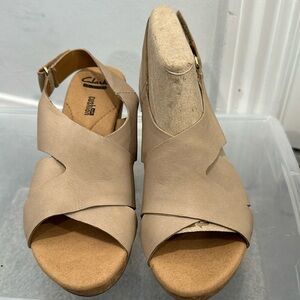 Clark’s wedge sandals in tan.